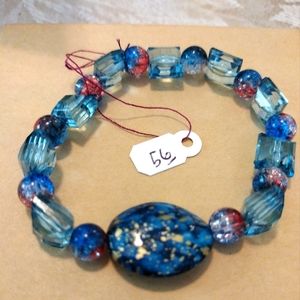 Artemis's Gems custom-made beaded bracelet with large gold and blue gem